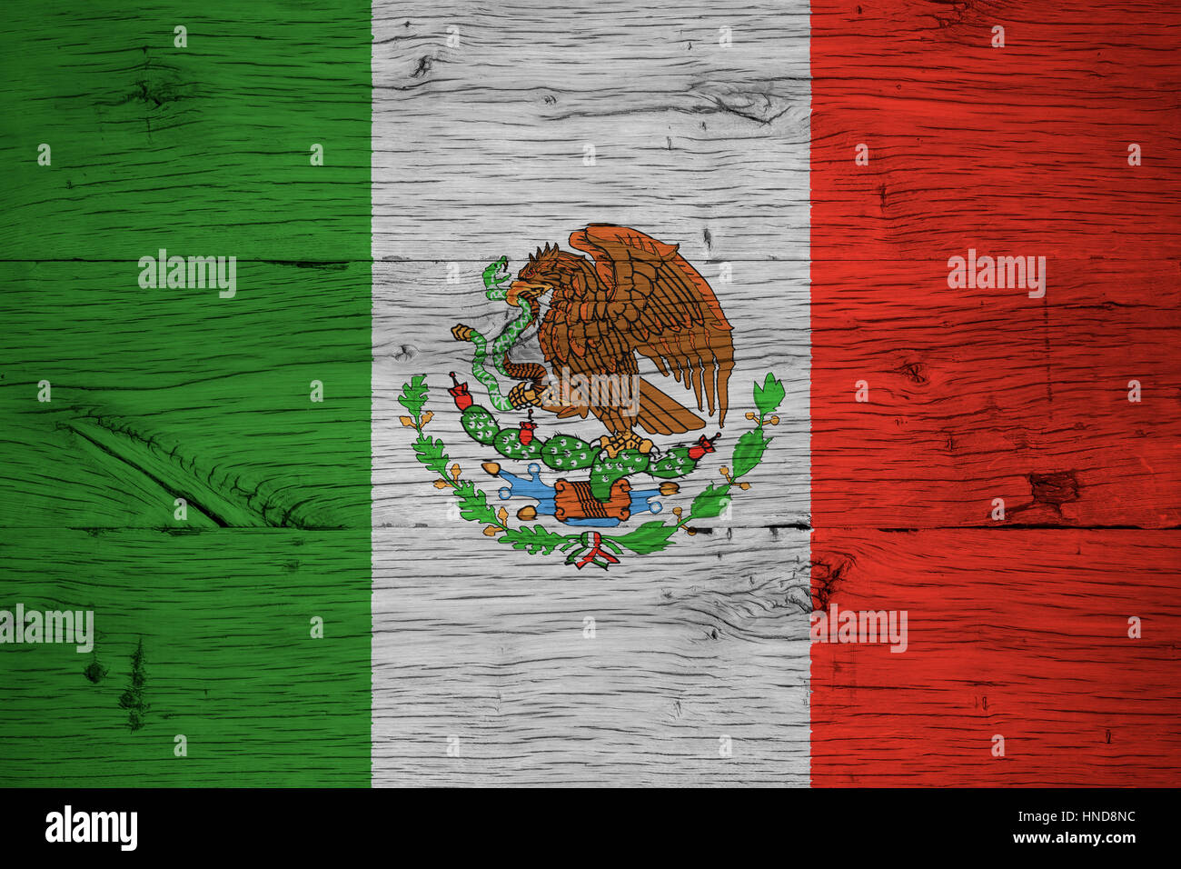 Mexico, Mexican national flag painted on old oak wood. Painting is colorful on planks of old train carriage. Stock Photo