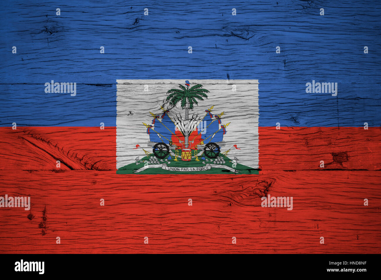 Haiti national flag with coat of arms painted on old oak wood. Painting is colorful on planks of old train carriage. Stock Photo