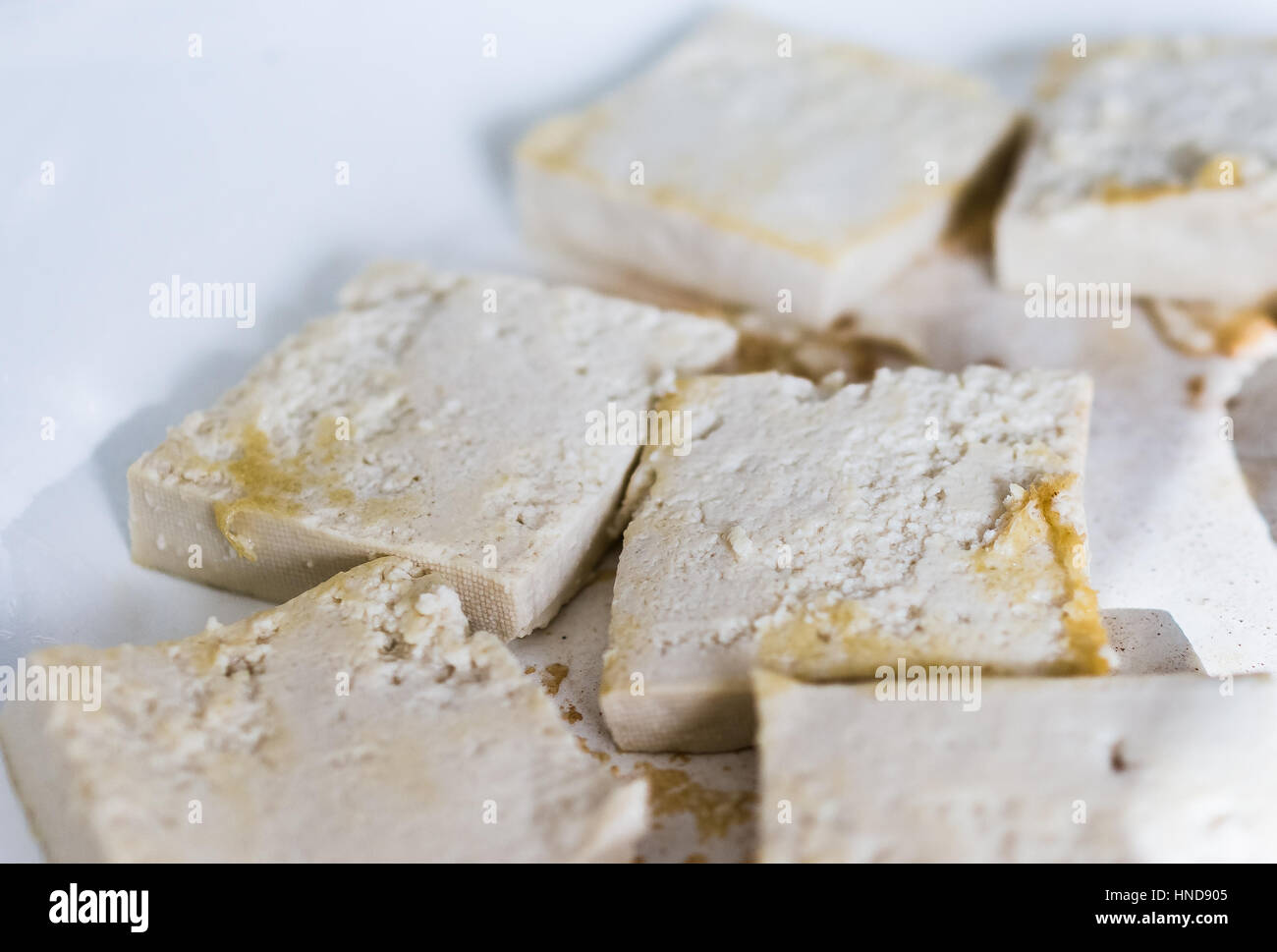 Tofu frying in ceramic pan Stock Photo Alamy