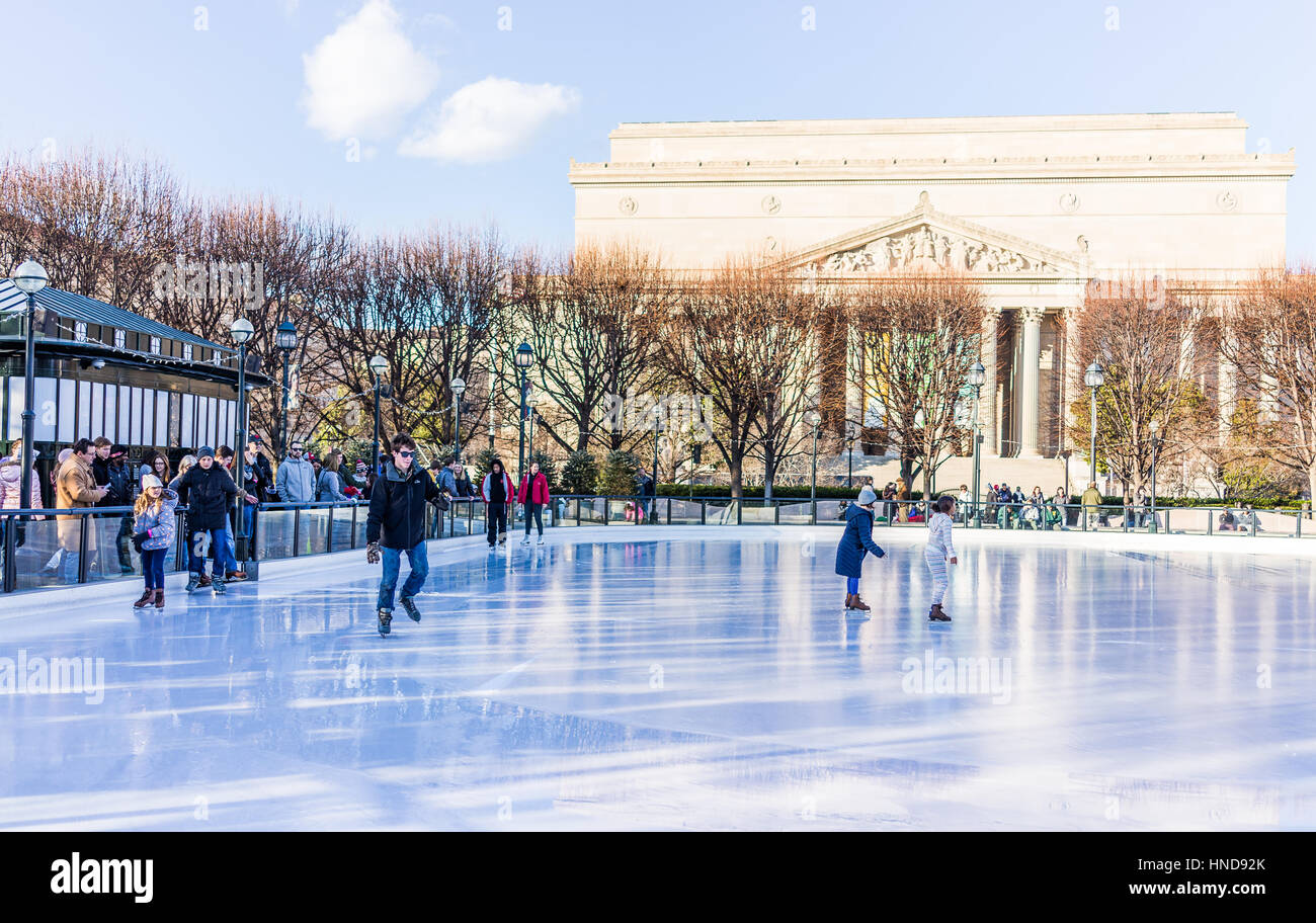 Washington DC, USA - January 28, 2017: People entering ice rink skating in National Gallery of Art Sculpture garden Stock Photo