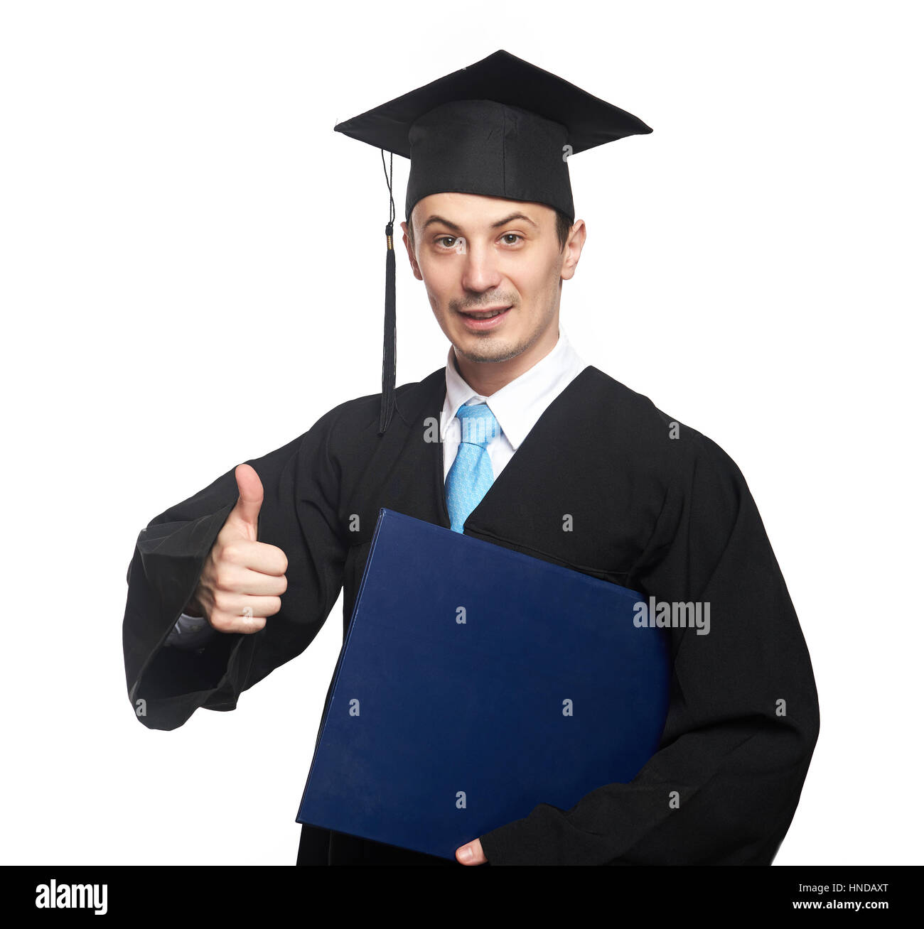 Student show thumb up with diploma on graduation isolated white Stock Photo