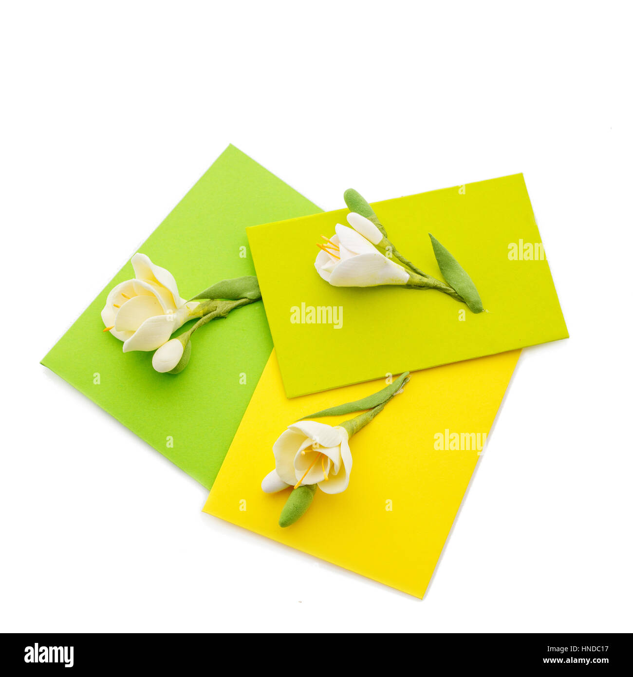 Closeup Shot Of Three Small Yellow Envelopes Decorated With Art