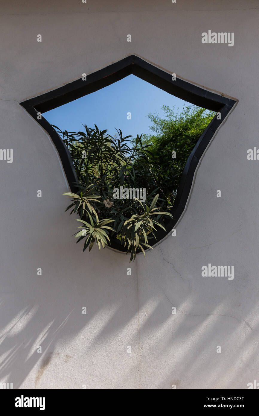 Decorative Chinese Window at Chao Pu-Ya Chinese Spirit Shrine -adjacent to the Thai-Chinese Cultural Centre; together they form the focal point of  Ch Stock Photo