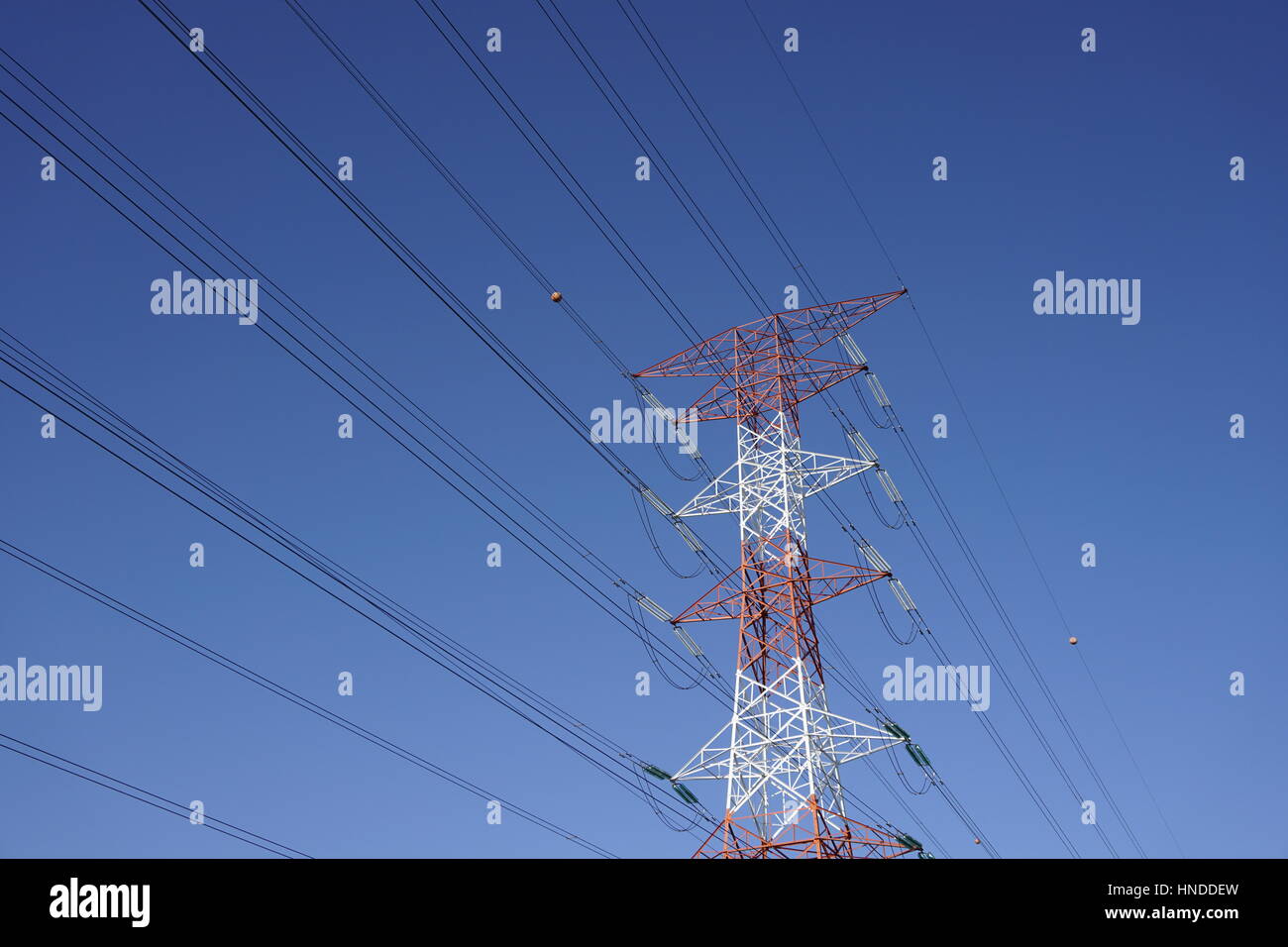 electricity transmission tower with blue skies Stock Photo