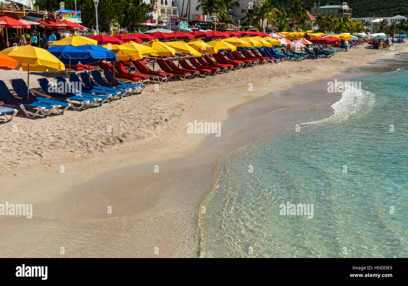 Sun loungers with colourful umbrellas, Philipsburg, Saint Maarten Stock Photo