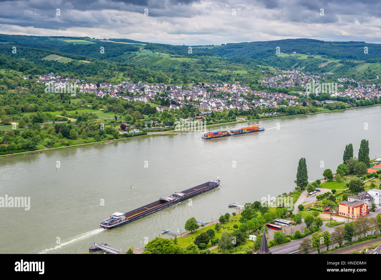 Brey, Germany - May 23, 2016: Сontainer and cargo ship on the Rhine River, Rhine Valley, UNESCO World Heritage Site, Germany. Brey and Rhens in backgr Stock Photo
