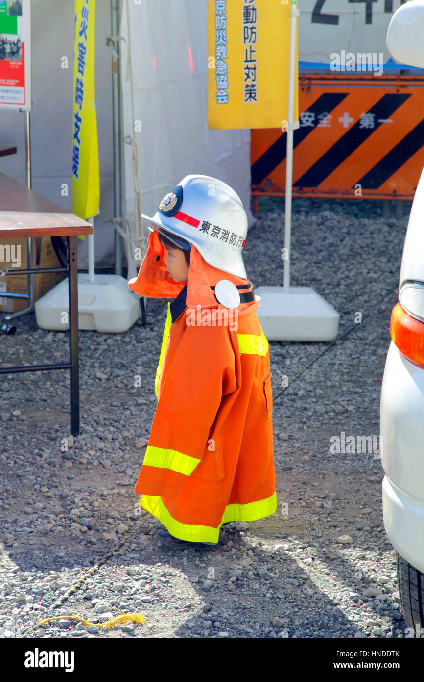 A Little Boy Wearing Fire Suit at a Emergency Drill Public Safety Event