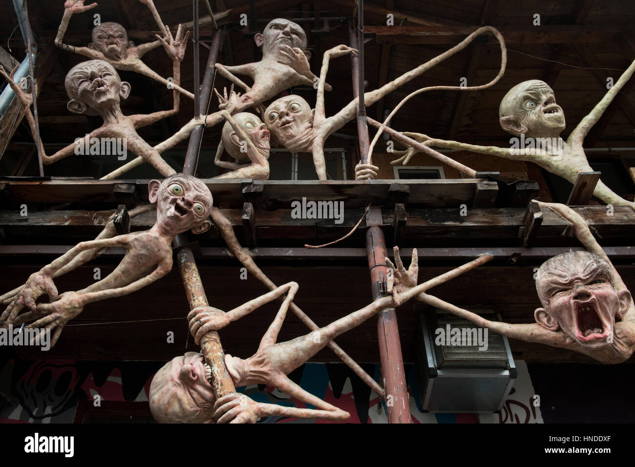 Sculptures decorating a facade of a building in Metelkova Mesto, an urban squat and autonomous social center in the center of Ljubljana, Slovenia. Stock Photo