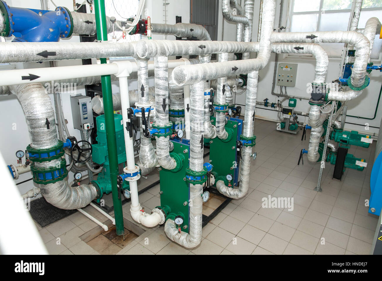 Pipes in a boiler room. Isolation of pipes. Water heating. Power supply