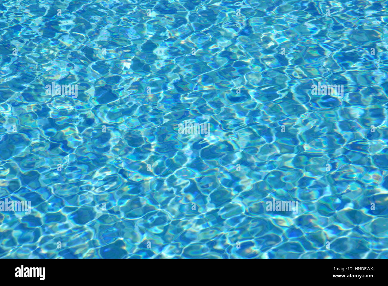 Light refractions in swimming pool Stock Photo