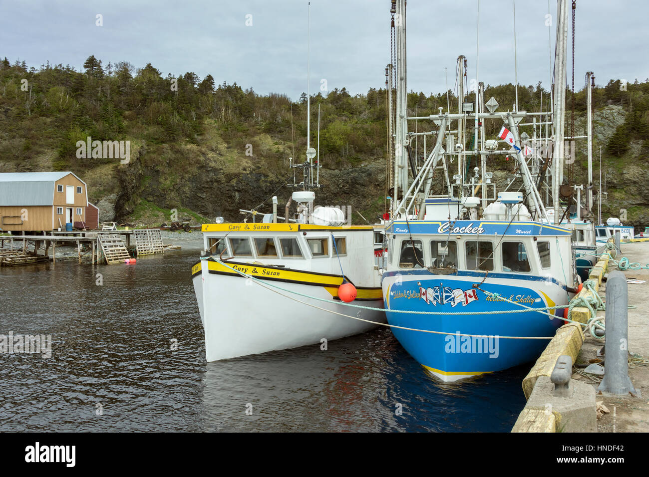Fishing boats at the wharf at Trout River, Newfoundland Stock Photo Alamy