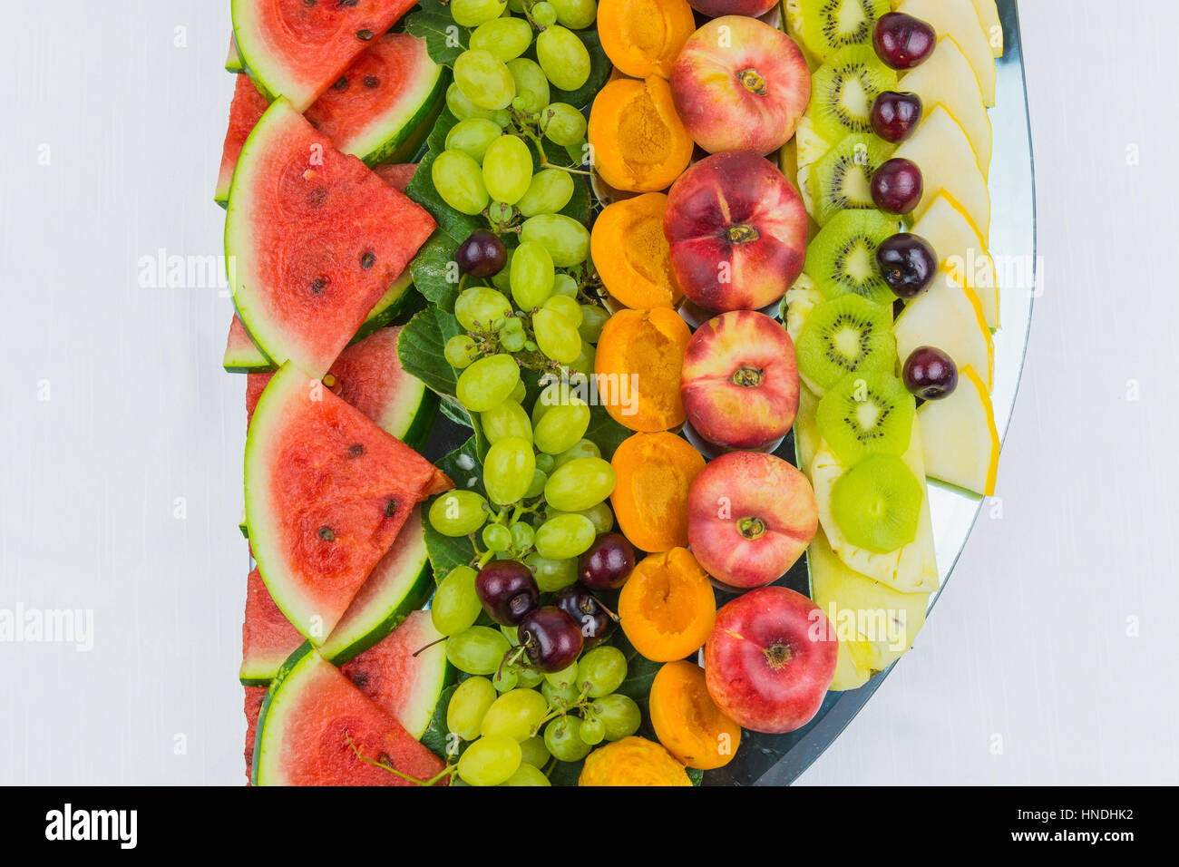 compositions of fresh fruit cut for buffets. typical summer fruits of Sicily, refreshing and healthy. Stock Photo