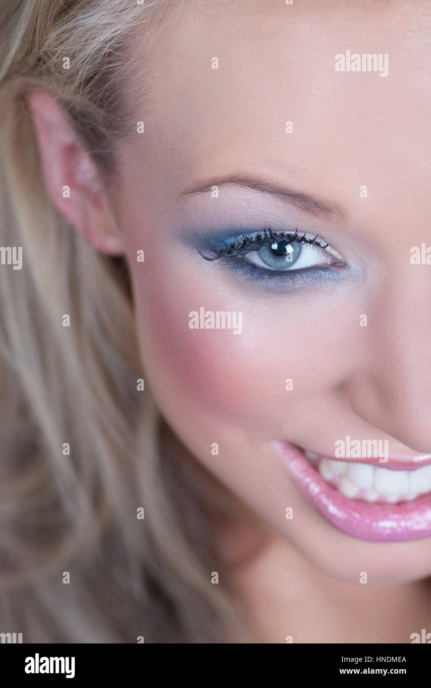 Happy young woman smiling Stock Photo - Alamy