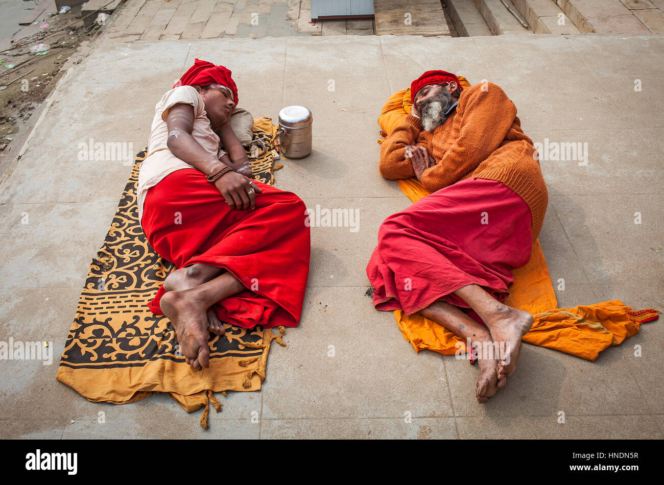 Sadhus sleeping, in the ghats of Ganges river, Varanasi, Uttar Pradesh, India. Stock Photo