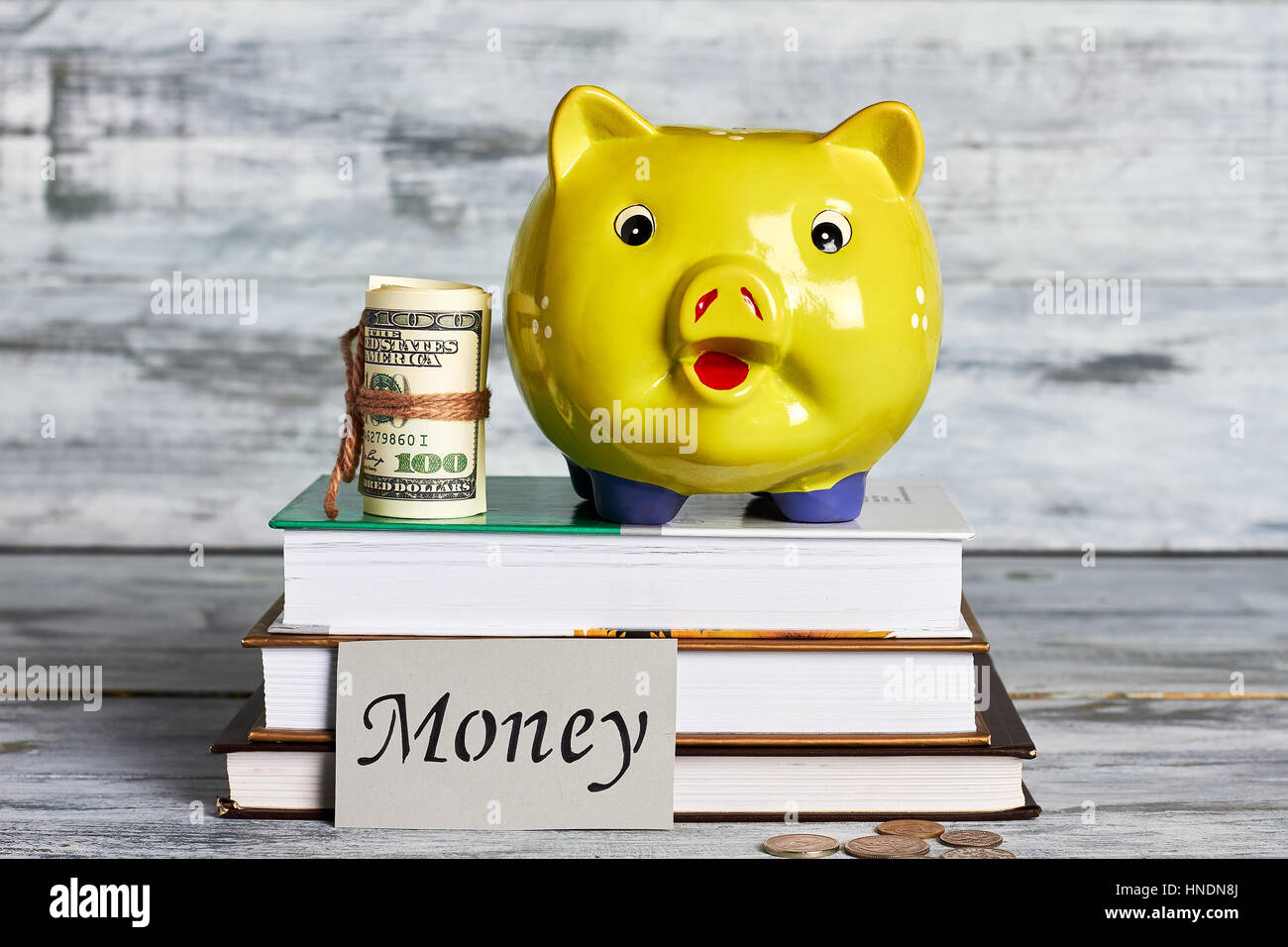 Roll of dollars and moneybox Stock Photo Alamy