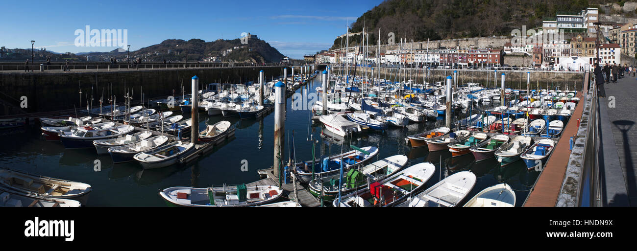 Basque Country, Spain boats in the port and view of the skyline on the seafront of Donostia San