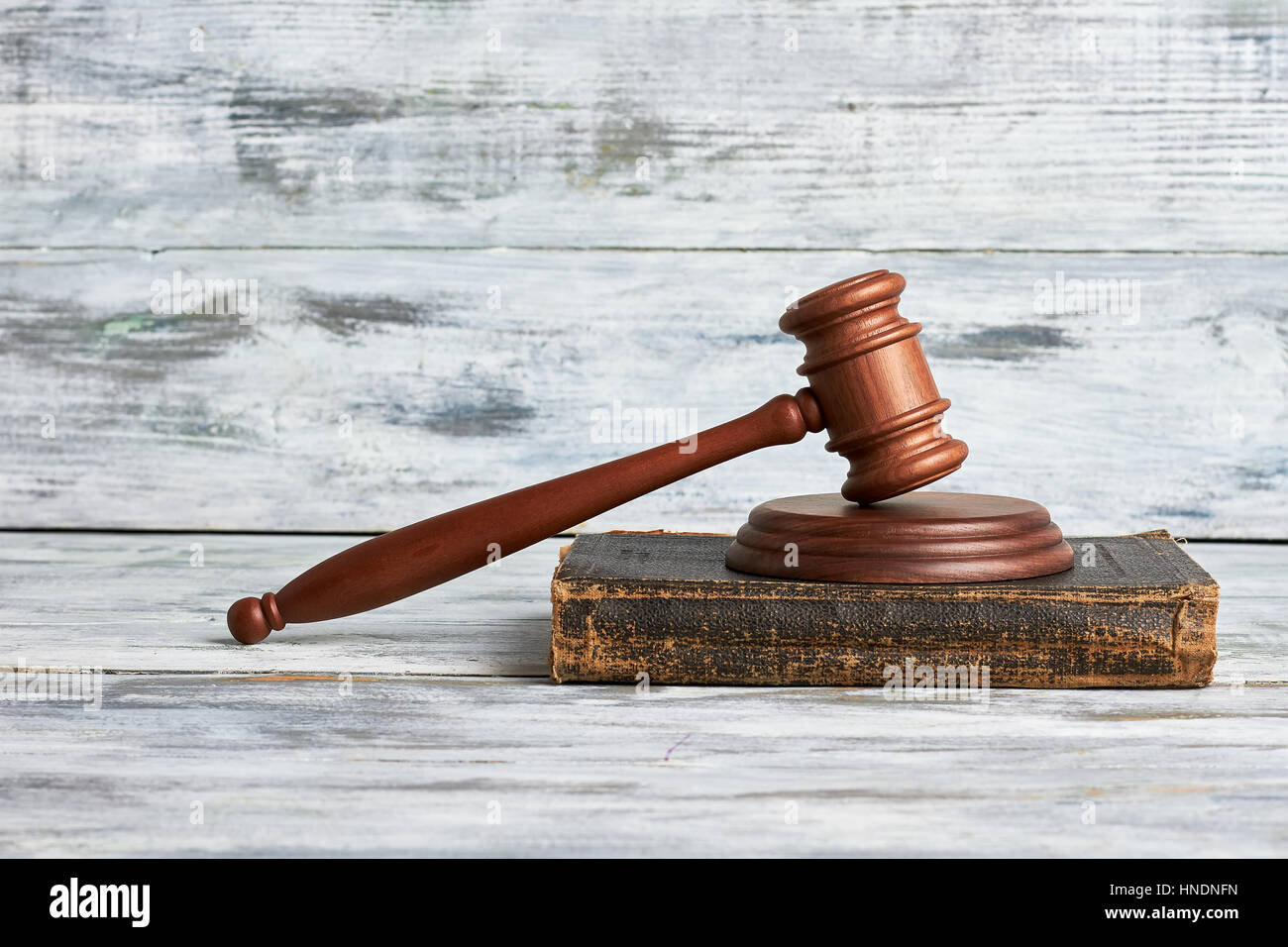 Law mallet on wooden surface. Stock Photo