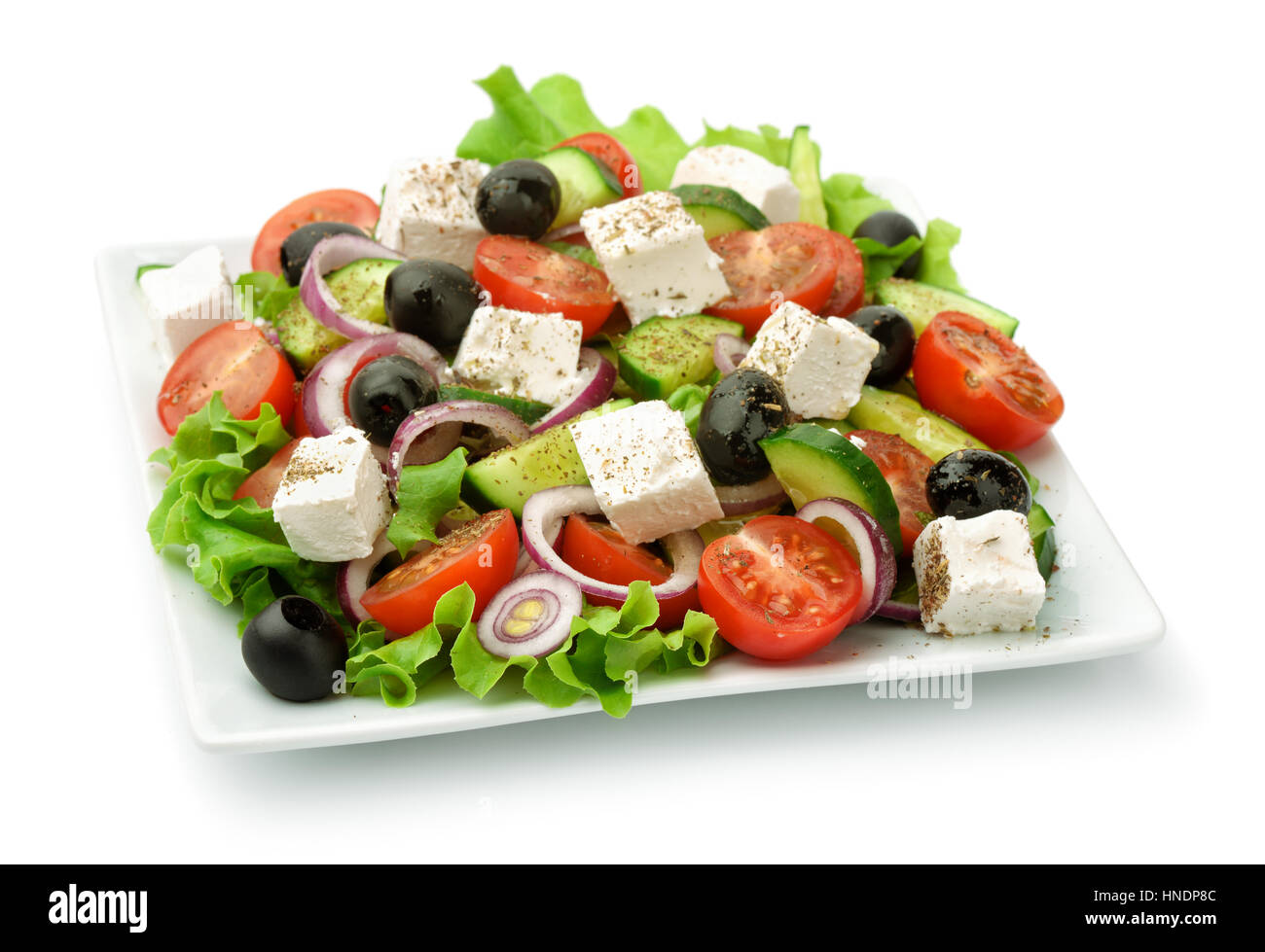 Square plate of greek salad isolated on white Stock Photo