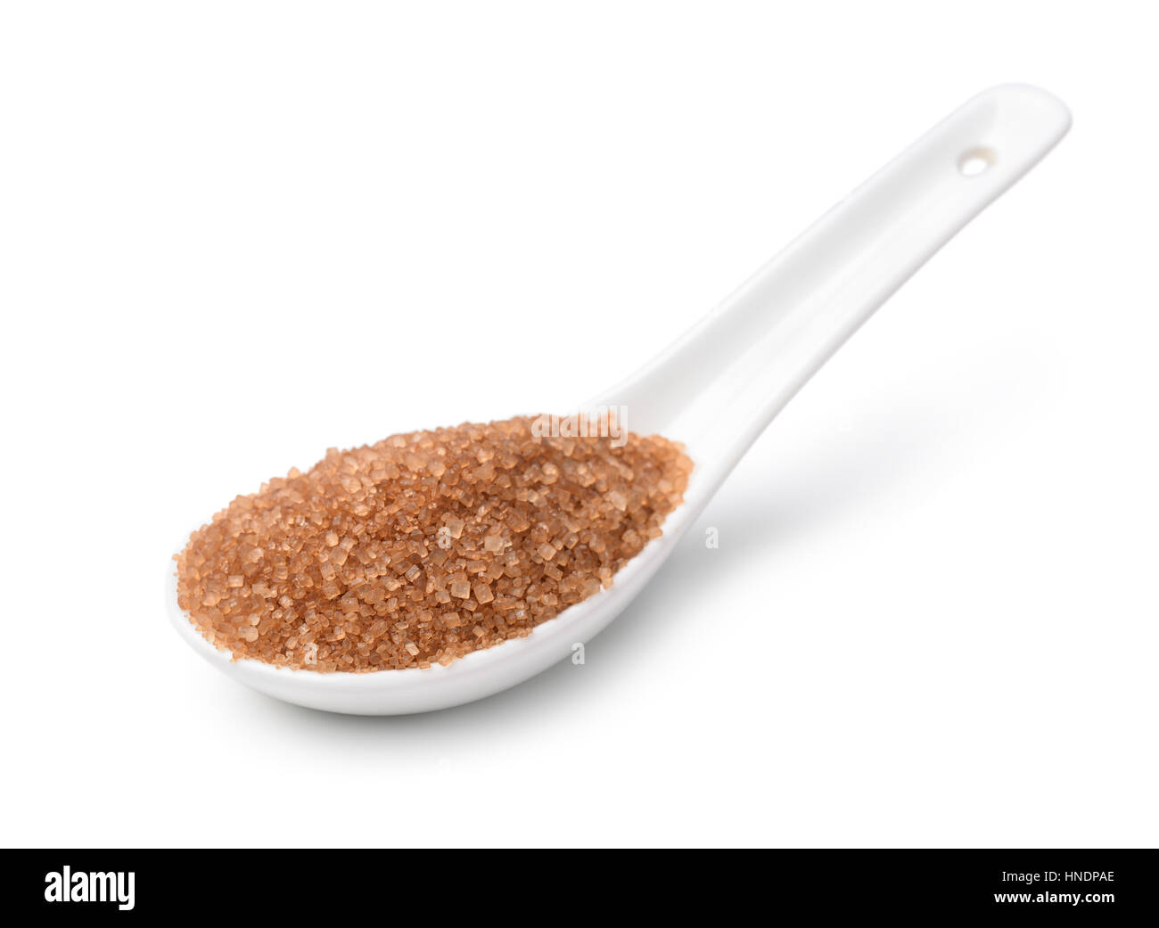 Ceramics spoon of brown sugar isolated on white Stock Photo Alamy