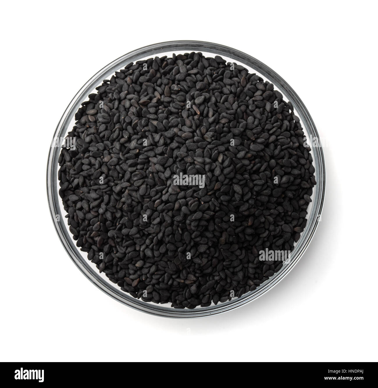 Top view of black sesame seeds bowl isolated on white Stock Photo - Alamy