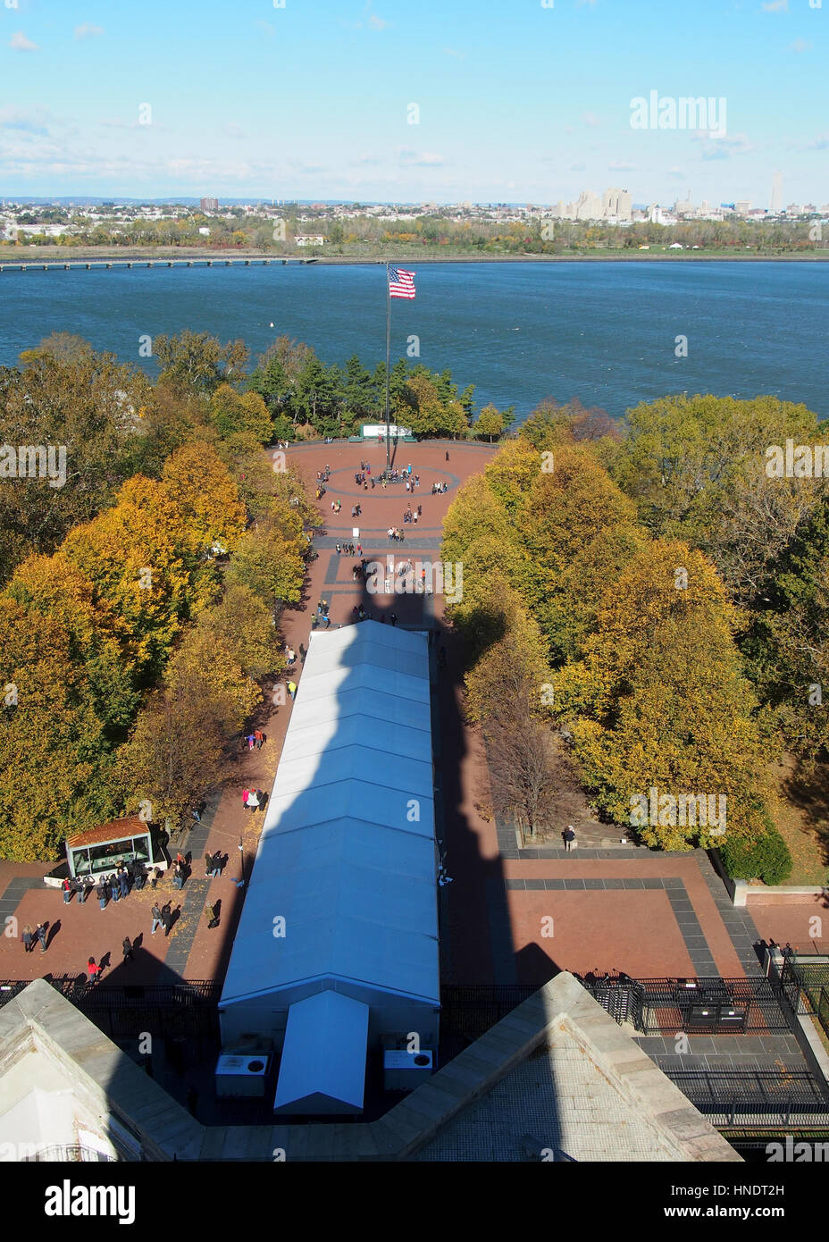 The shadow of the statue of liberty falls over the island Stock Photo