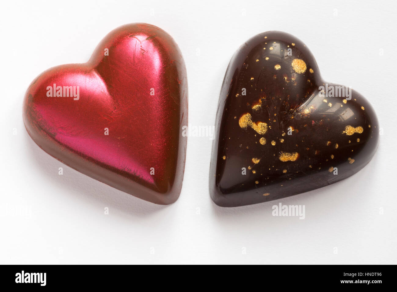 M&S chocolate hearts for Valentines day Milk dulce de leche heart & Dark torte heart isolated on white background Stock Photo