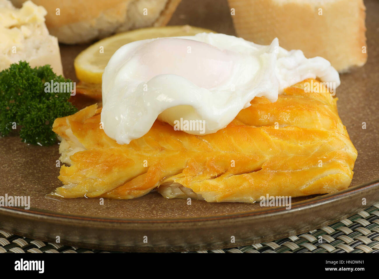 smoked haddock served with a whole poached egg Stock Photo Alamy