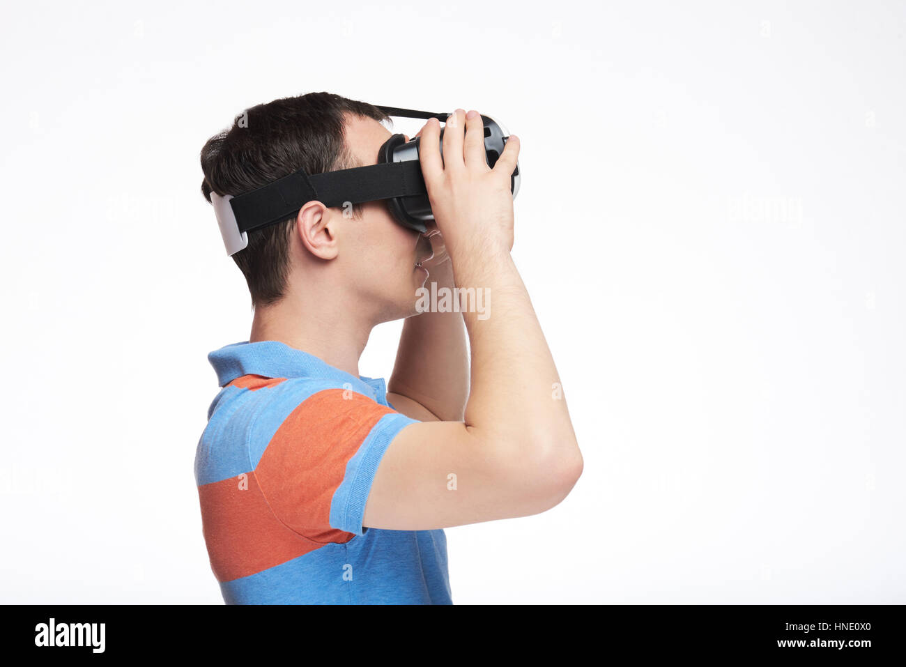 Profile of man using virtual reality glasses. Guy in virtual reality glasses Stock Photo