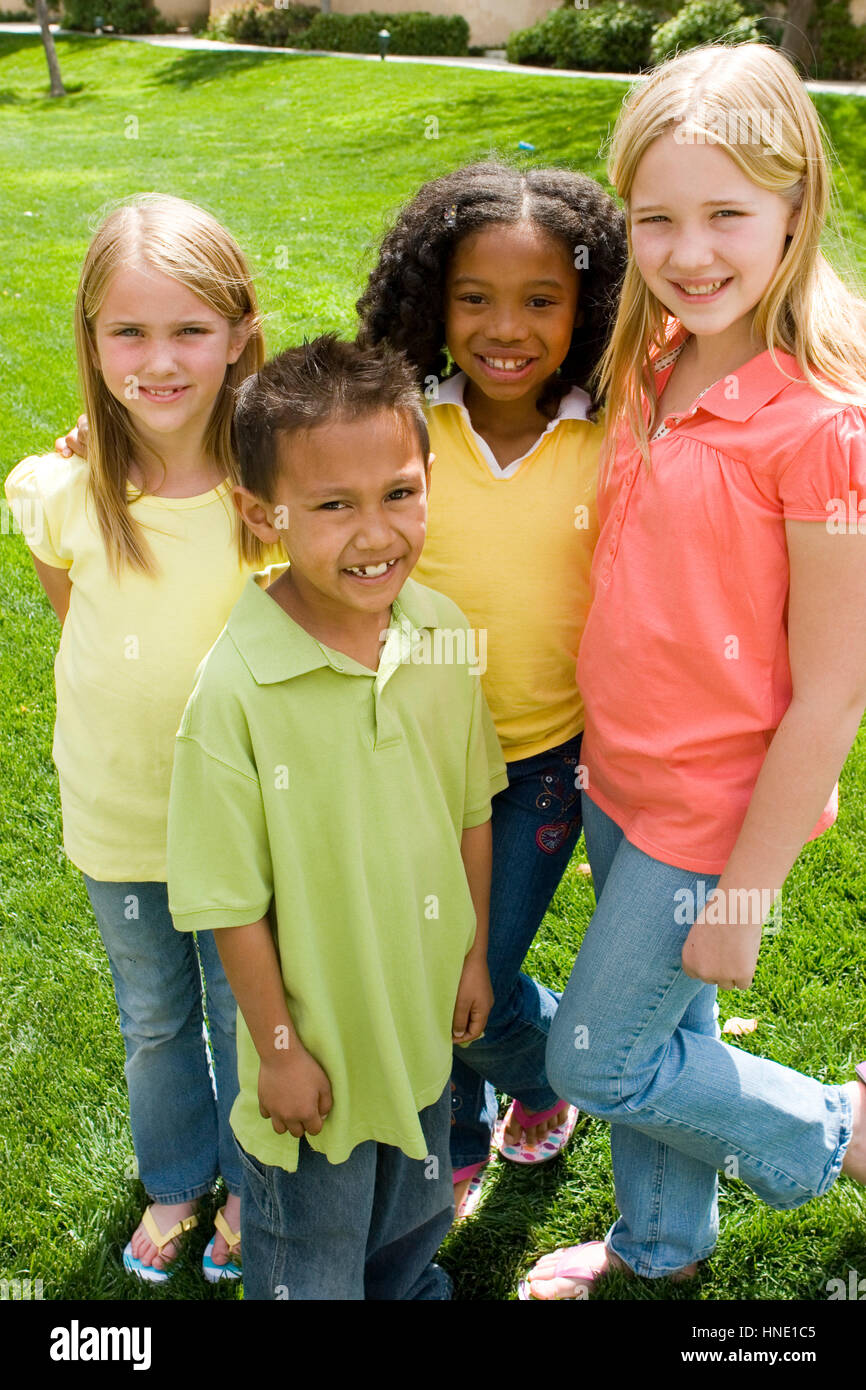 Happy diverse group of kids outside at a park Stock Photo - Alamy