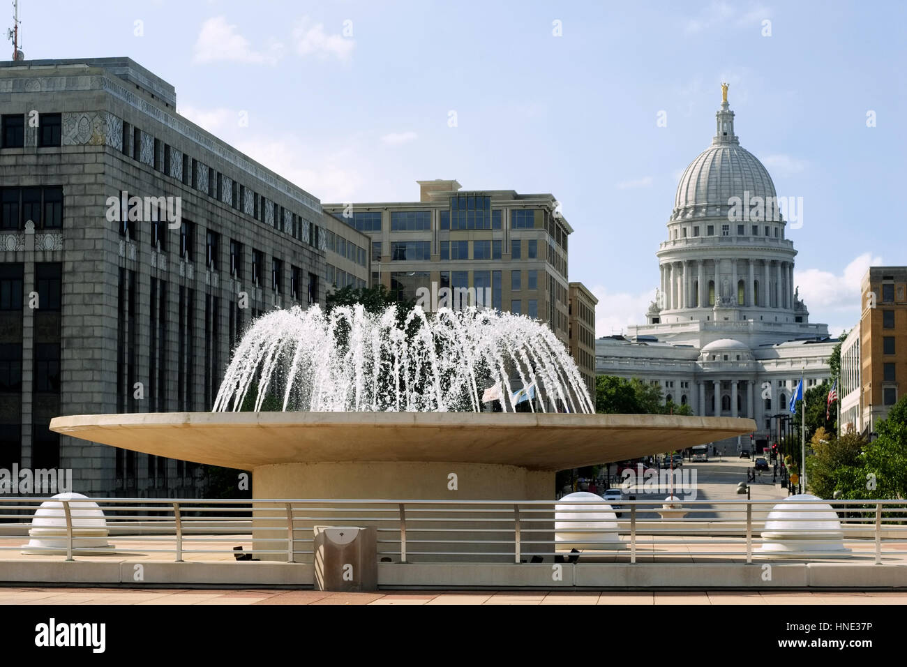 A fountain with the Wisconsin State Capitol in the background Stock Photo