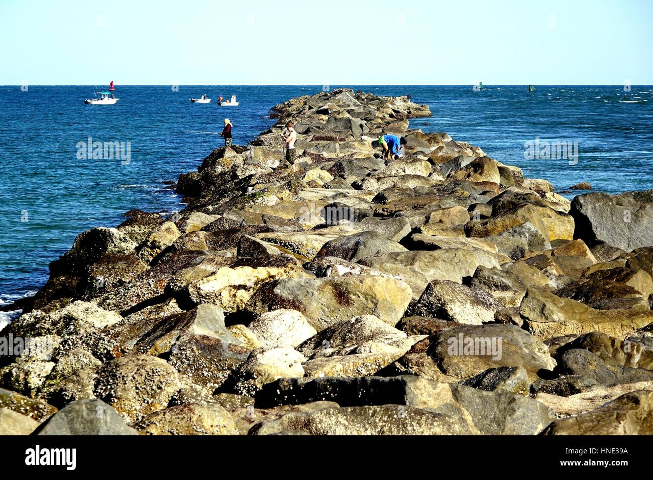 Fishermen on the jetty at Lighthouse Point Park, Ponce Inlet, Florida