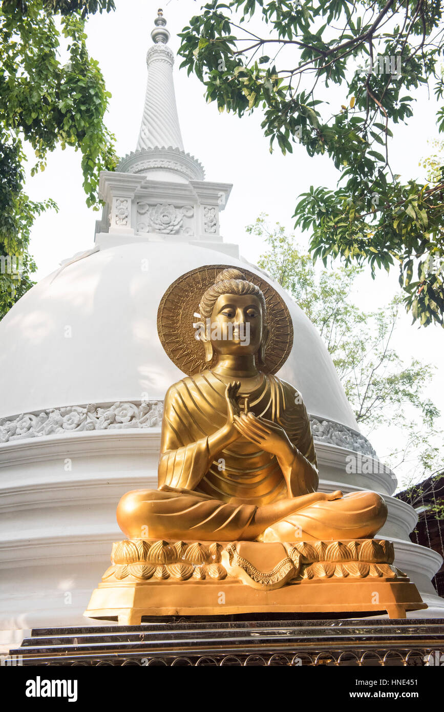 Buddha statue and stupa, Gangaramaya temple, Colombo, Sri Lanka Stock Photo