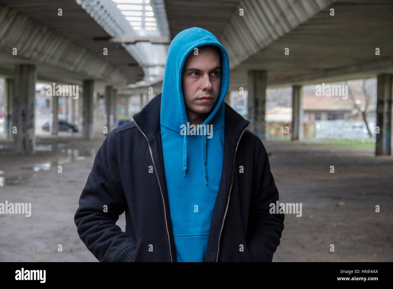 Young Man With A Blue Hood Stock Photo
