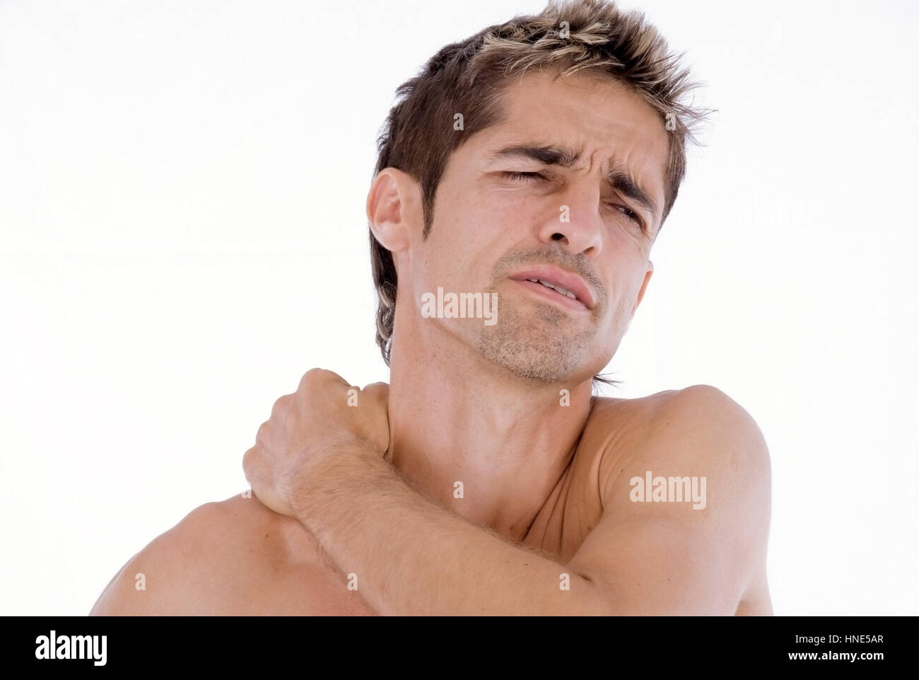 Model release, Mann, 35+,  mit Nackenschmerzen - man with pain in neck Stock Photo