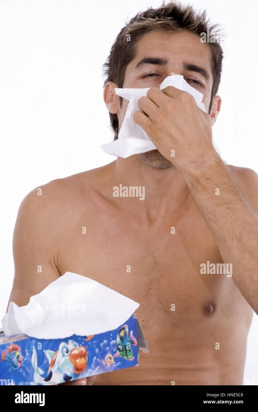 Model release, Mann schneuzt sich - man is blowing his nose Stock Photo
