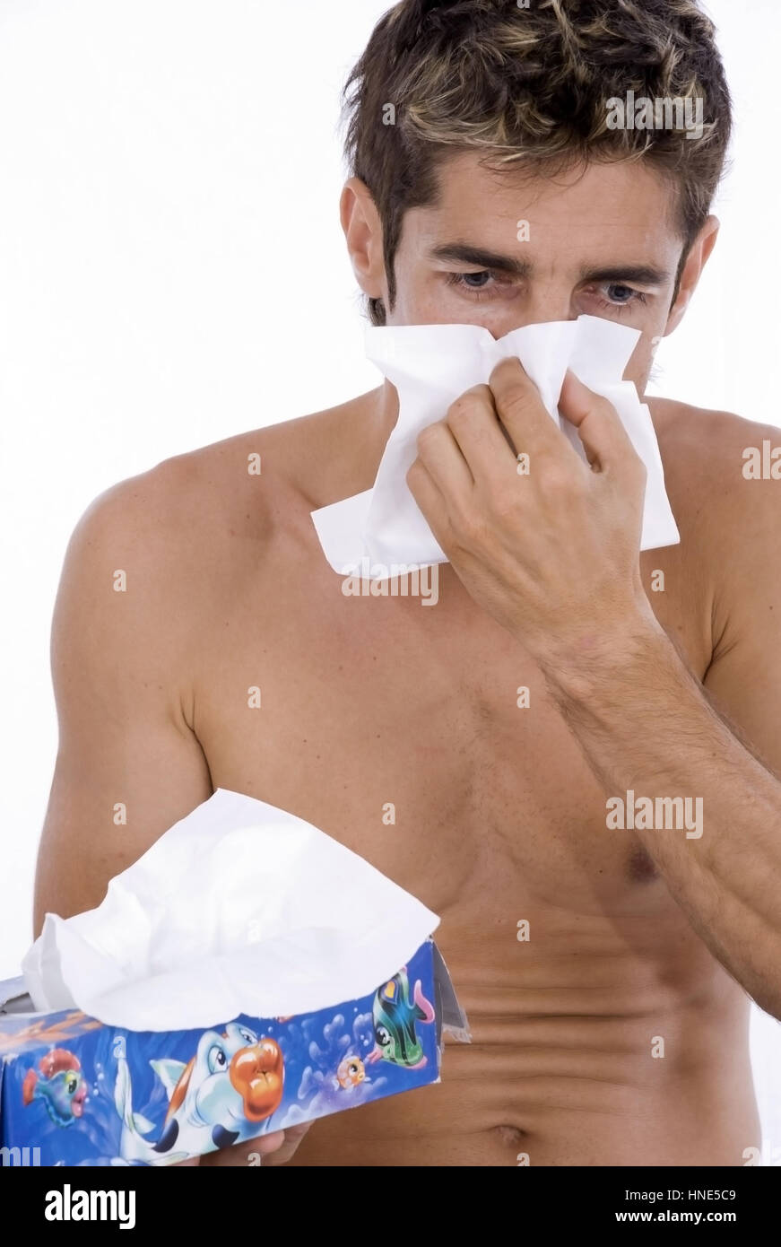 Model release, Mann schneuzt sich - man is blowing his nose Stock Photo