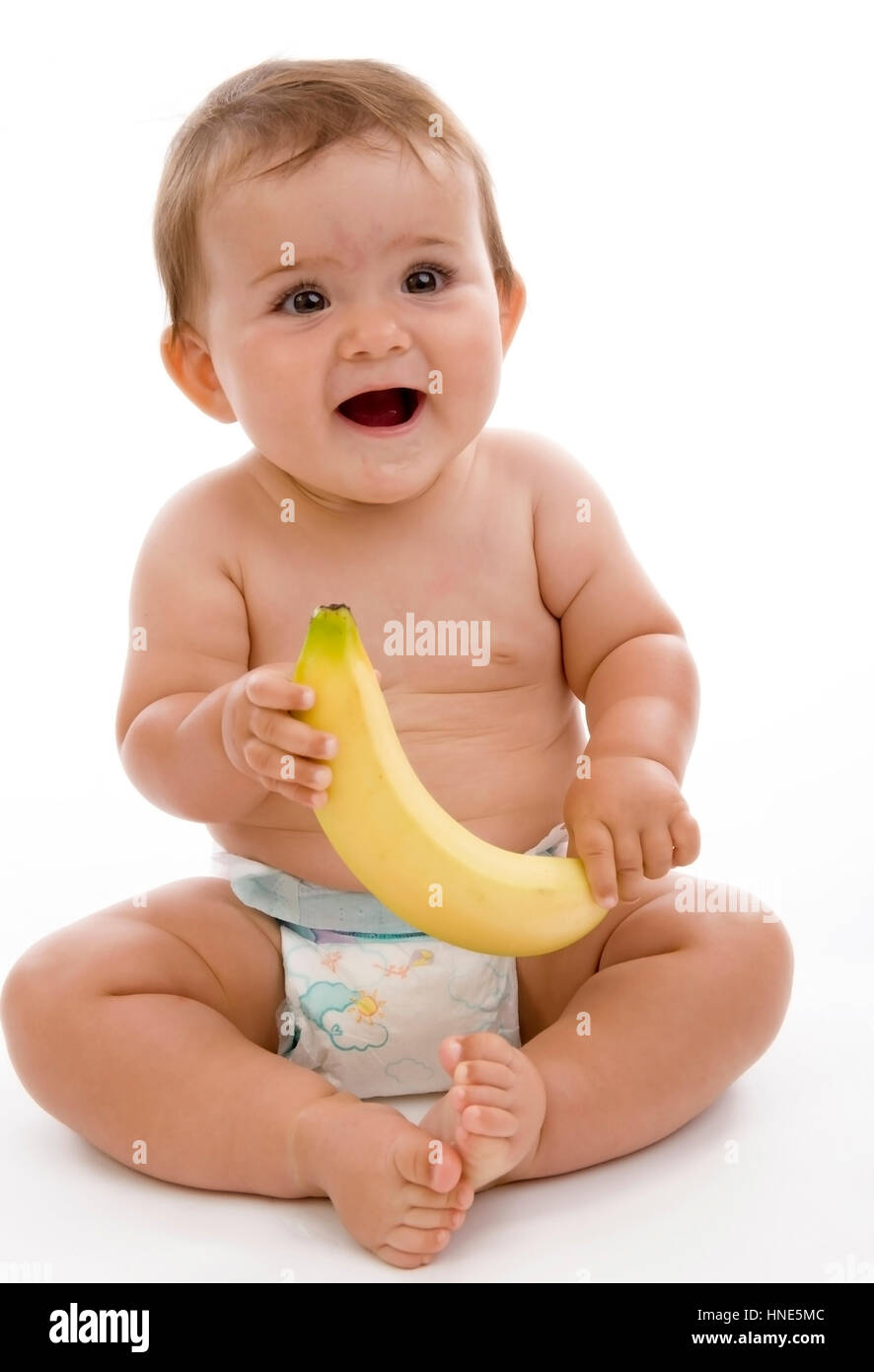 Model release, Kleinkind in Windeln mit Banane in der Hand - little child  with banana Stock Photo - Alamy