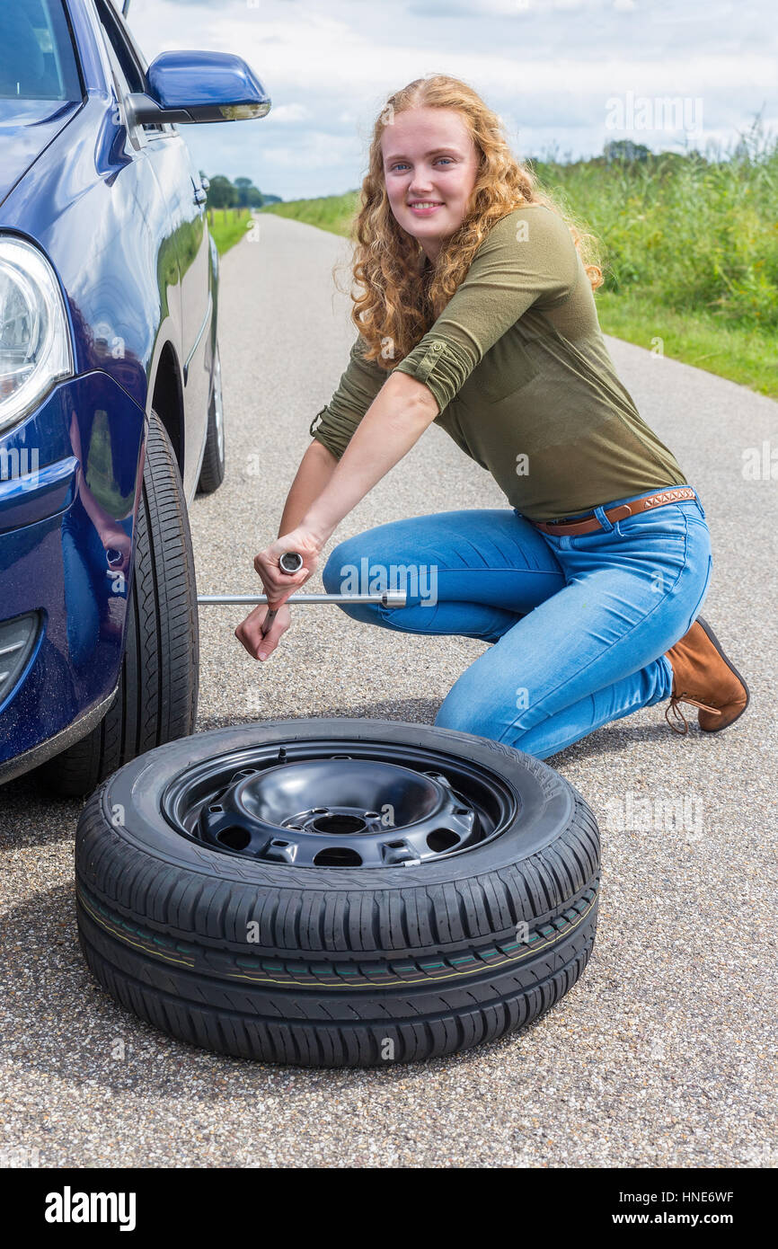 Flat tire woman hires stock photography and images Alamy
