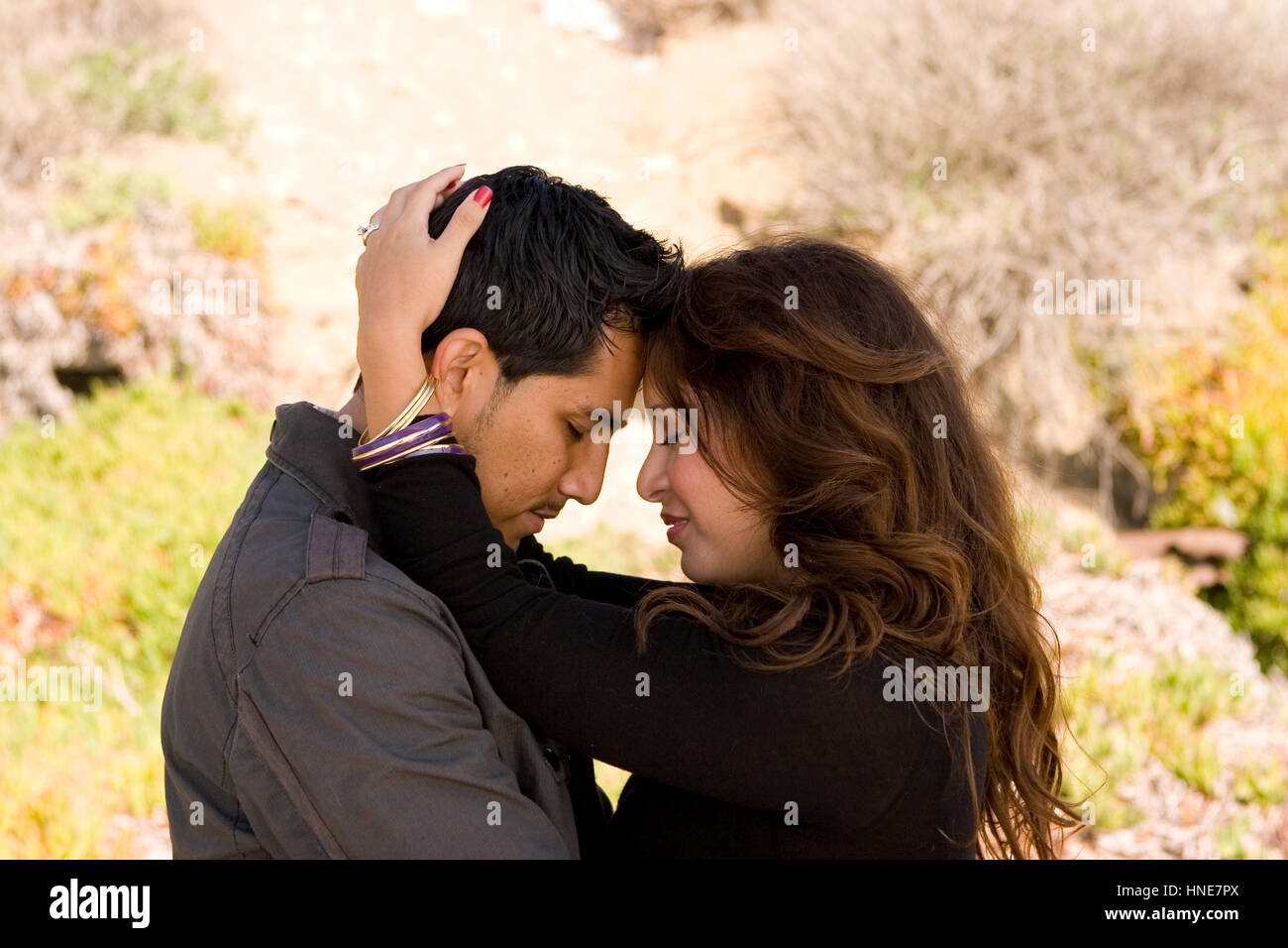 Beautiful Hispanic couple laughing and smiling Stock Photo - Alamy