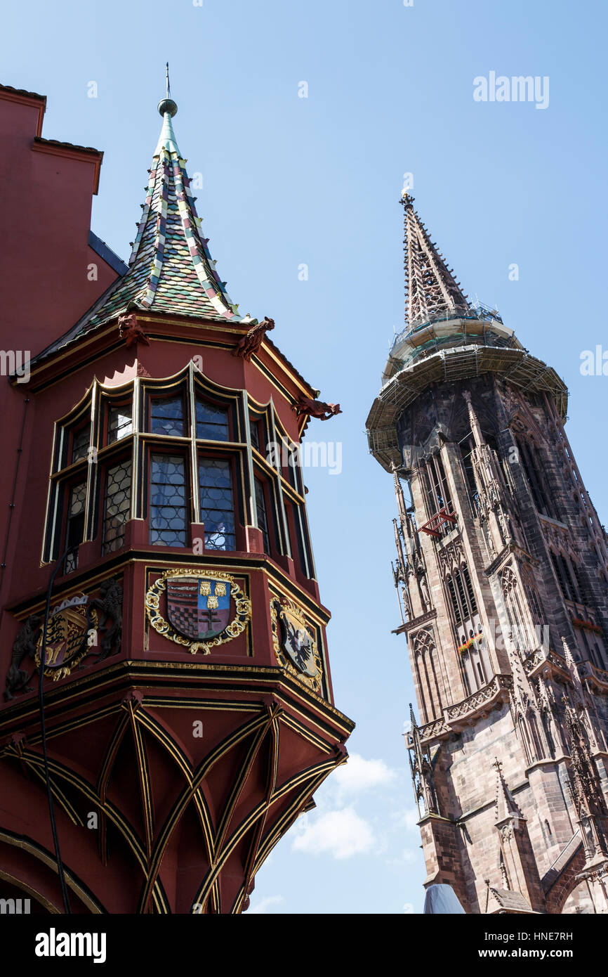 Architectural features in the Münsterplatz at Freiburg – in the foreground is the Kaufhaus with the minster behind. Stock Photo