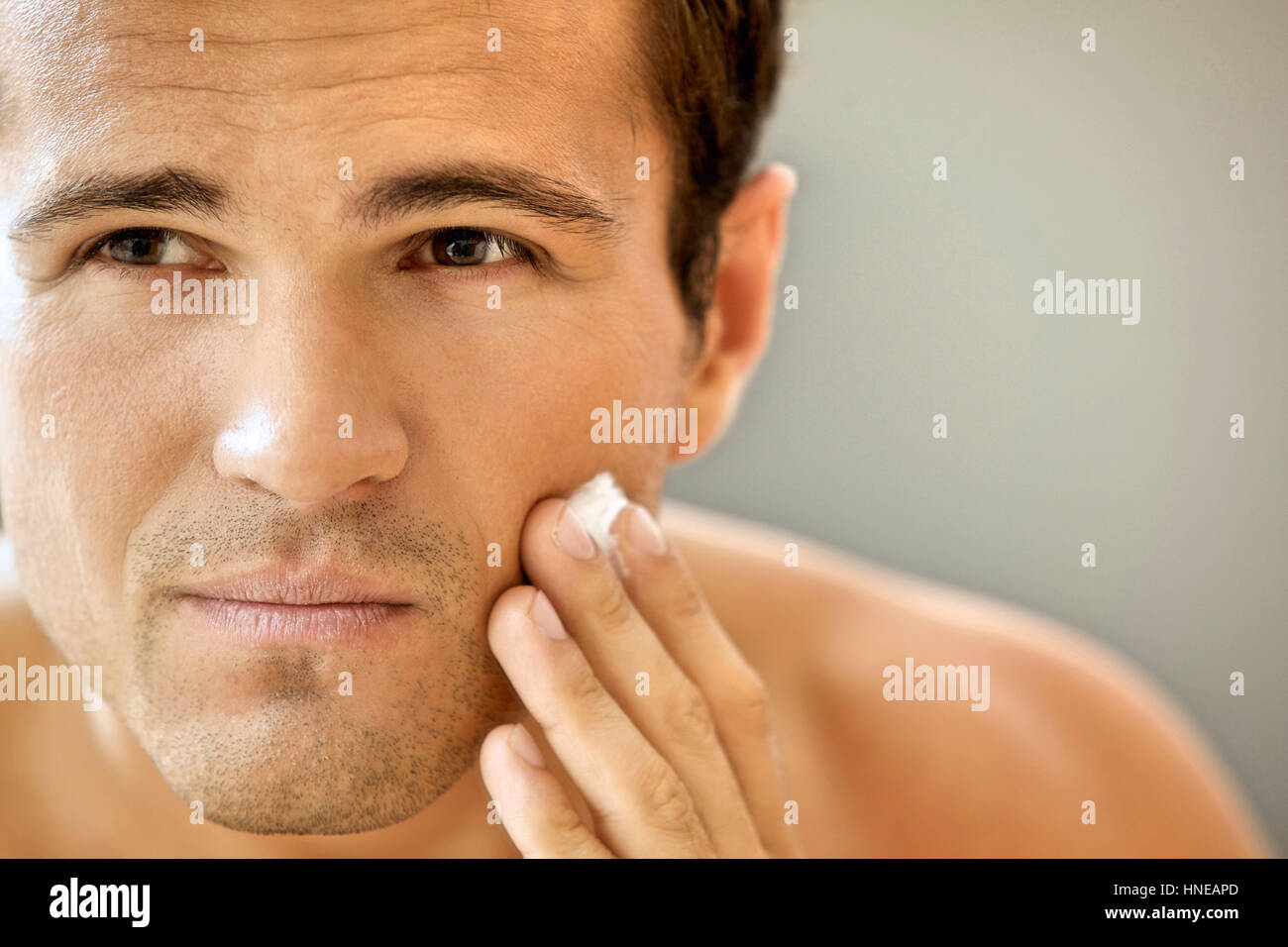 Closeup of young man applying shaving cream Stock Photo Alamy