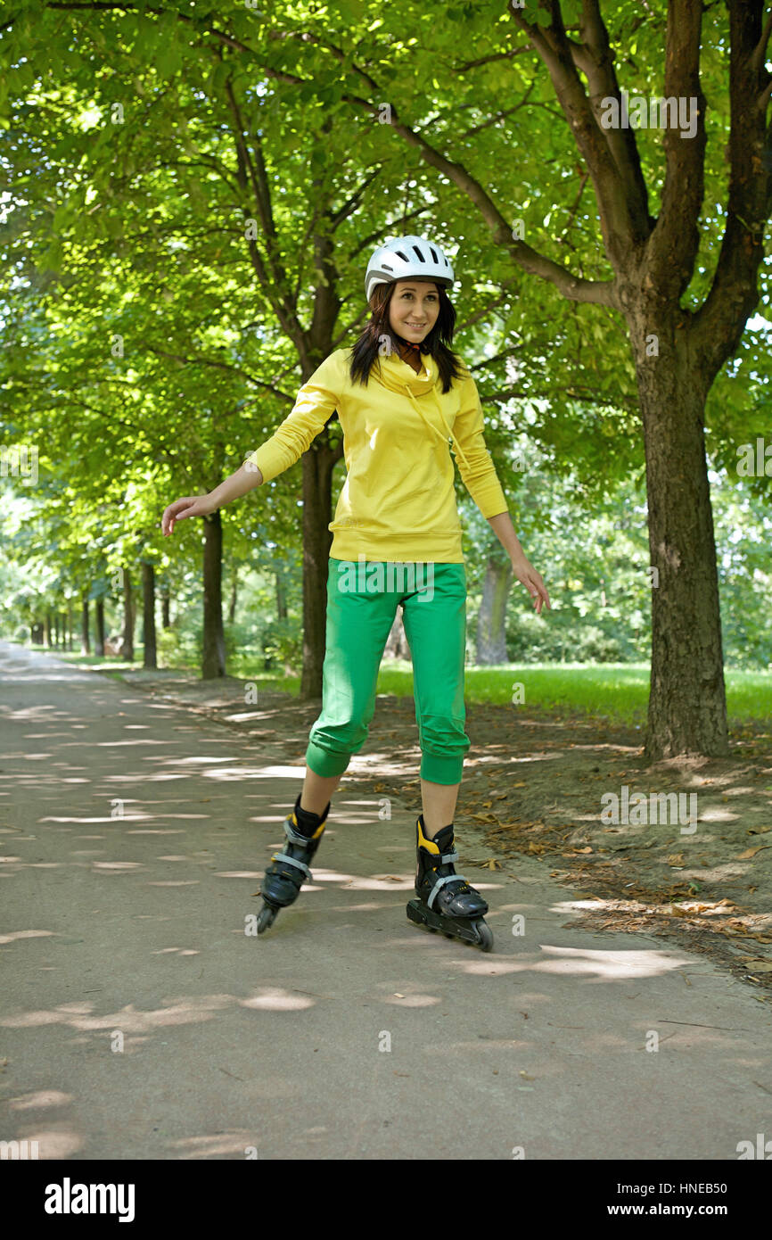 Yong woman riding roller skate Stock Photo Alamy