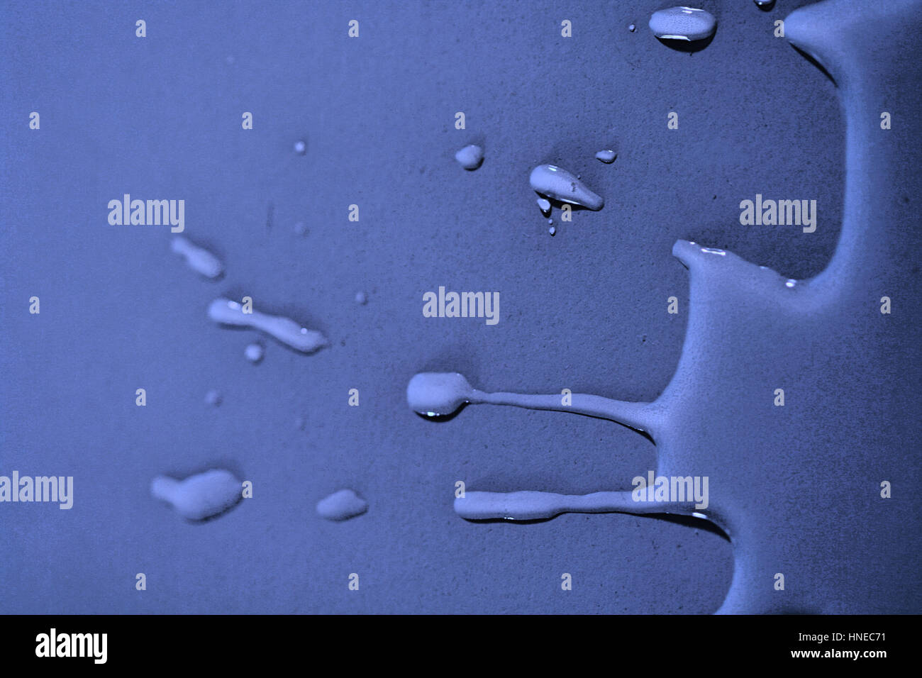 Water on blue background - close up Stock Photo - Alamy