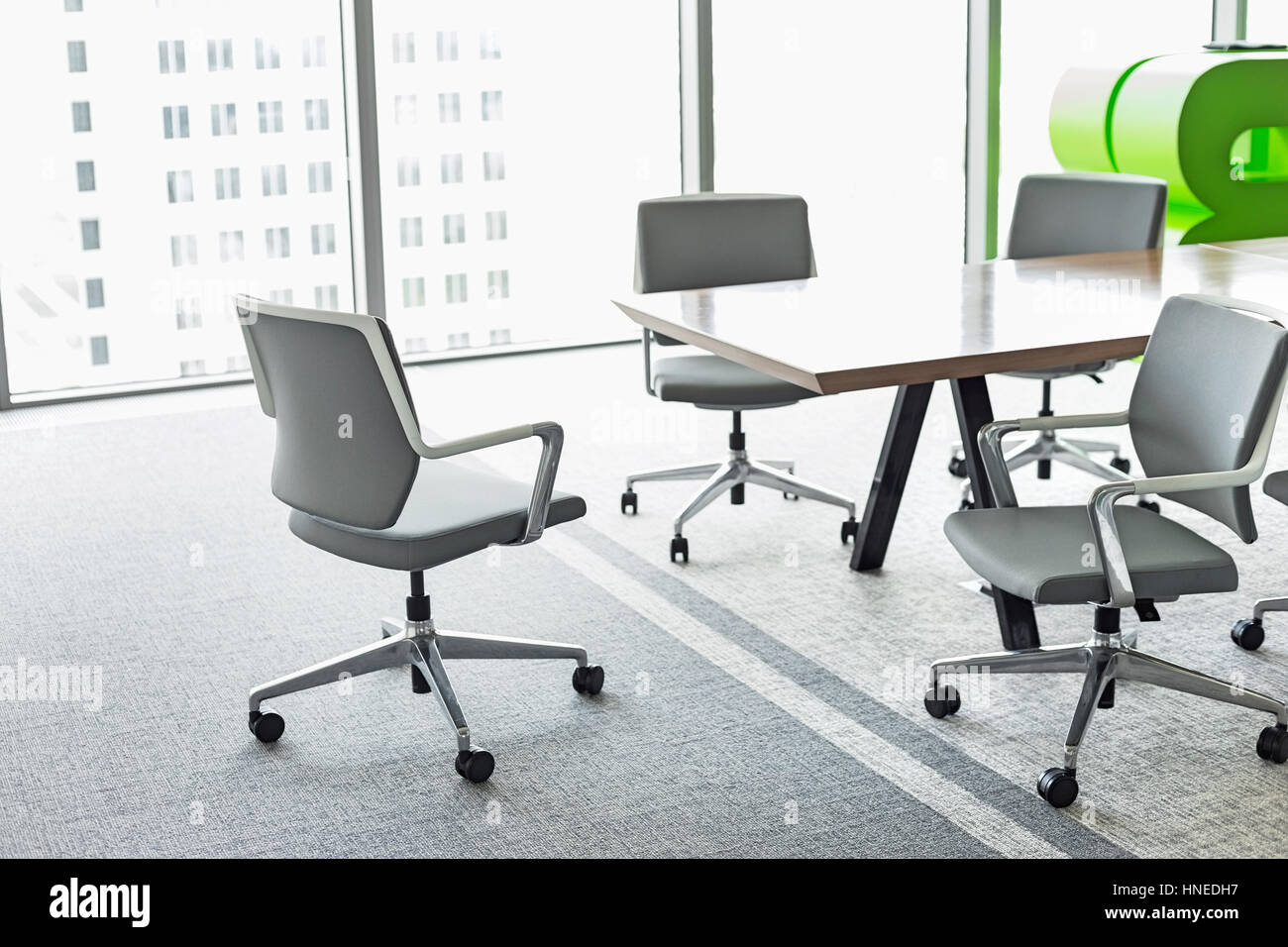 Office chairs at conference table Stock Photo Alamy
