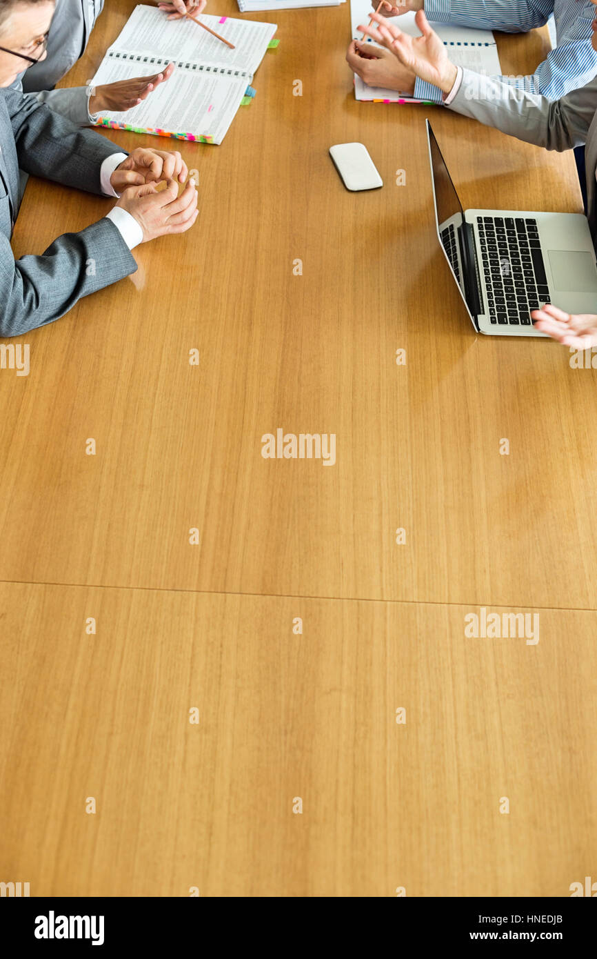 Cropped image of businesspeople discussing at conference table Stock ...