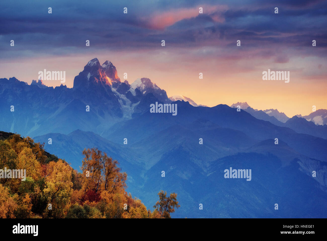Autumn landscape and snowy mountain peaks Stock Photo - Alamy