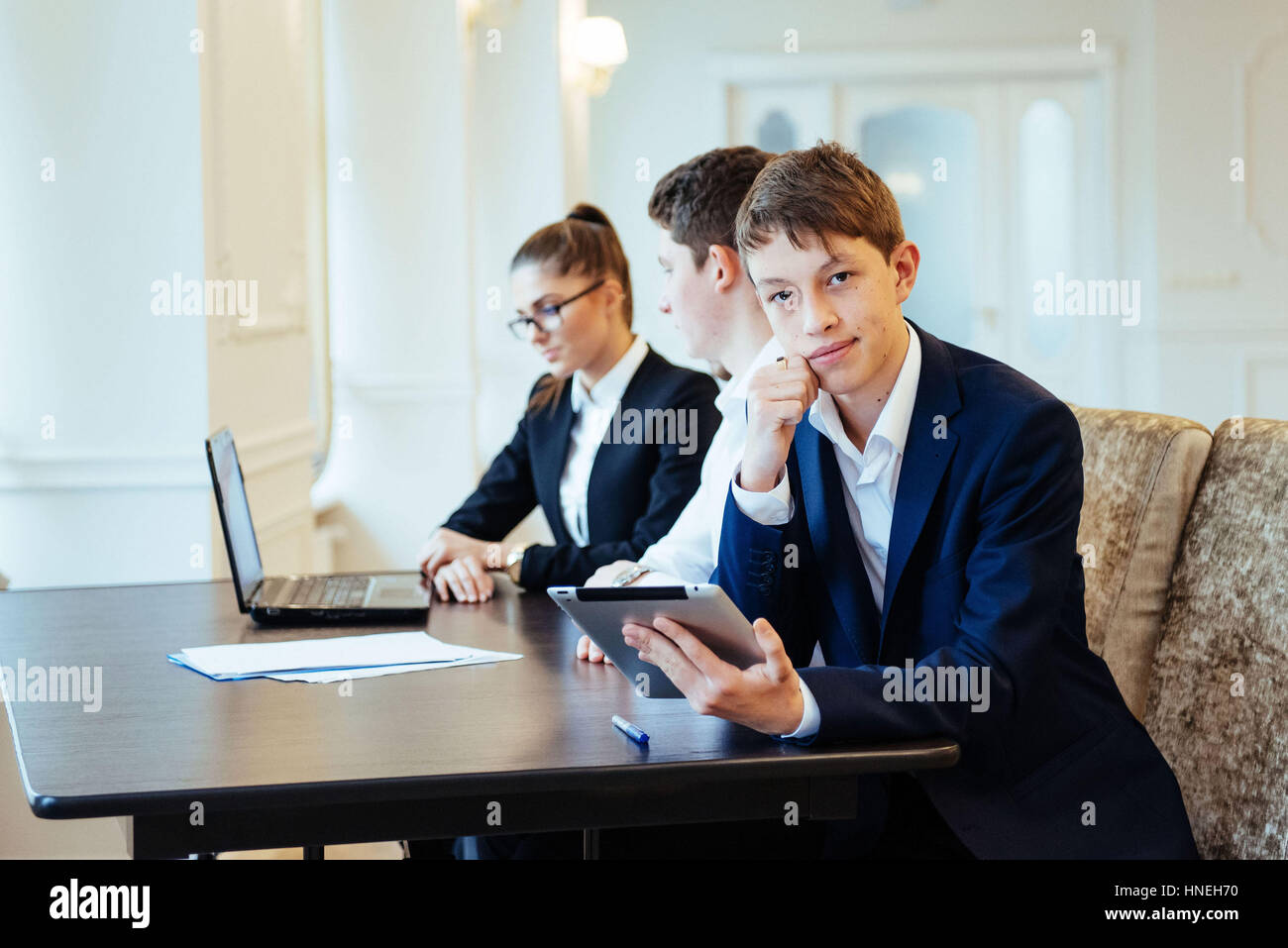 Students with laptops and tablet Stock Photo