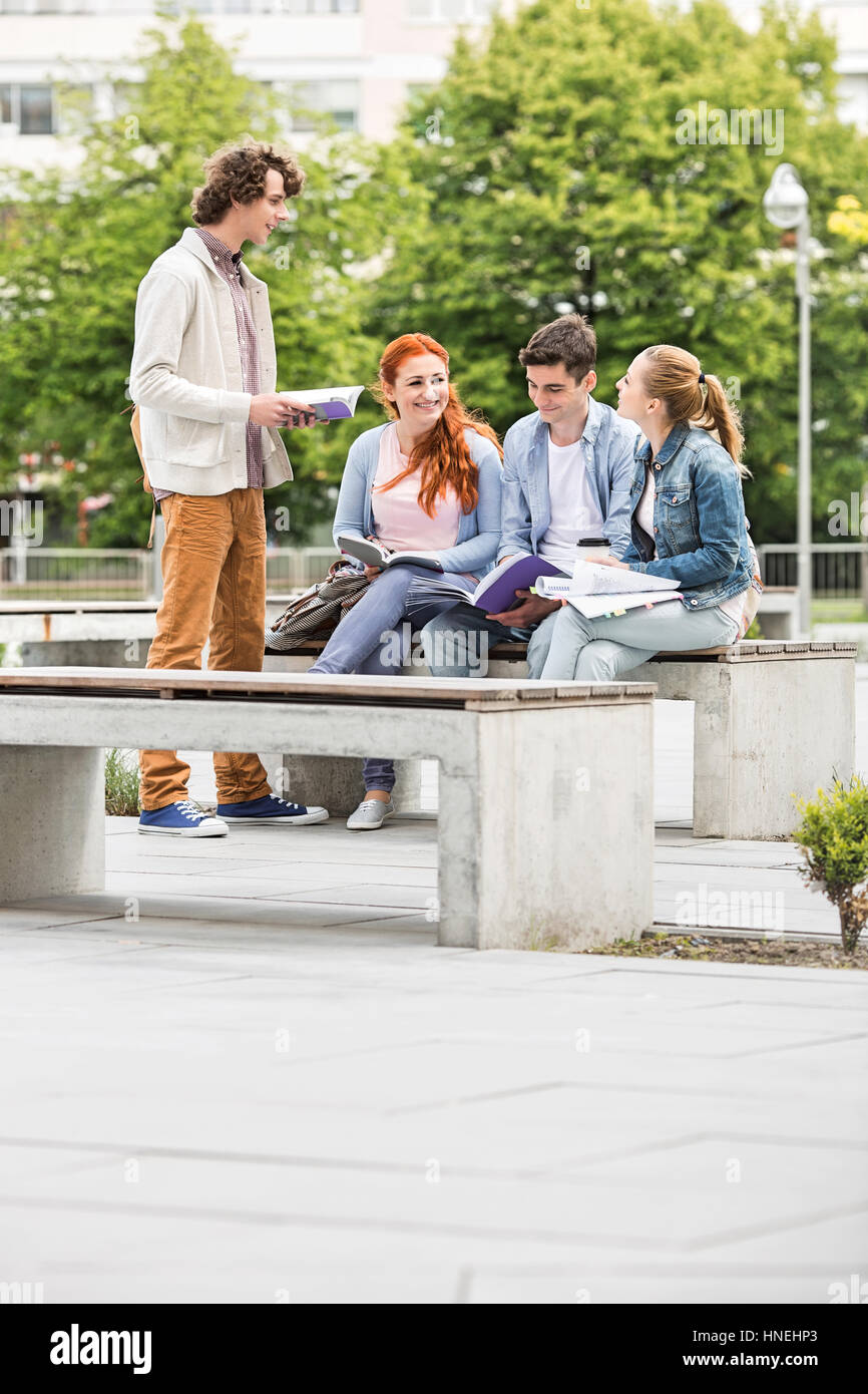 Group of friends studying together at college campus Stock Photo