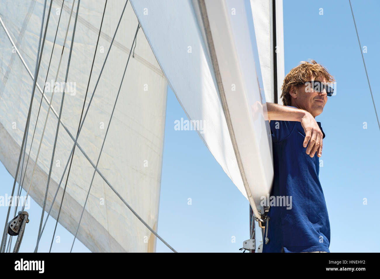 Side view of middle-aged man on yacht Stock Photo
