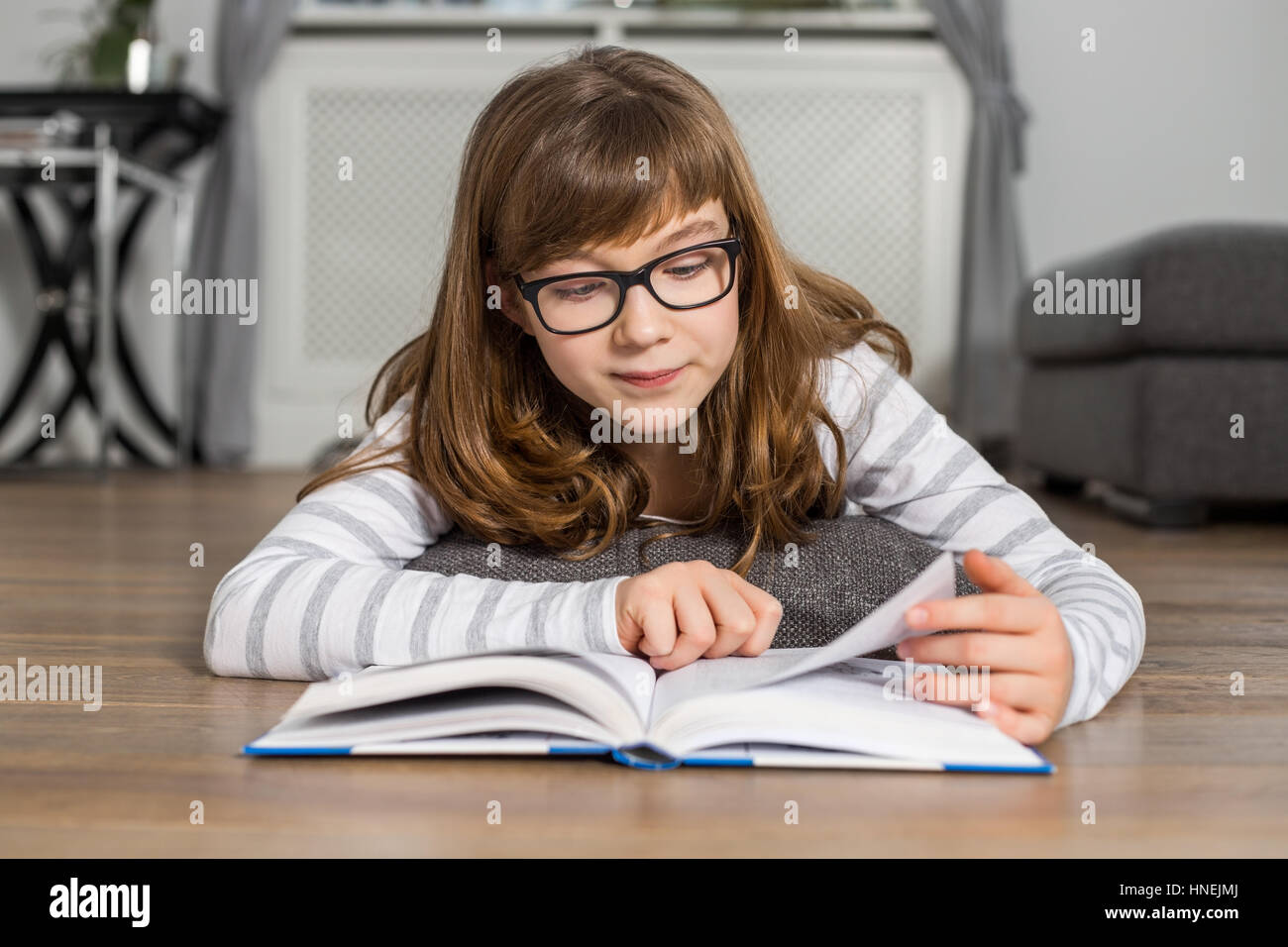 Brunette girl lying on floor hi-res stock photography and images - Alamy